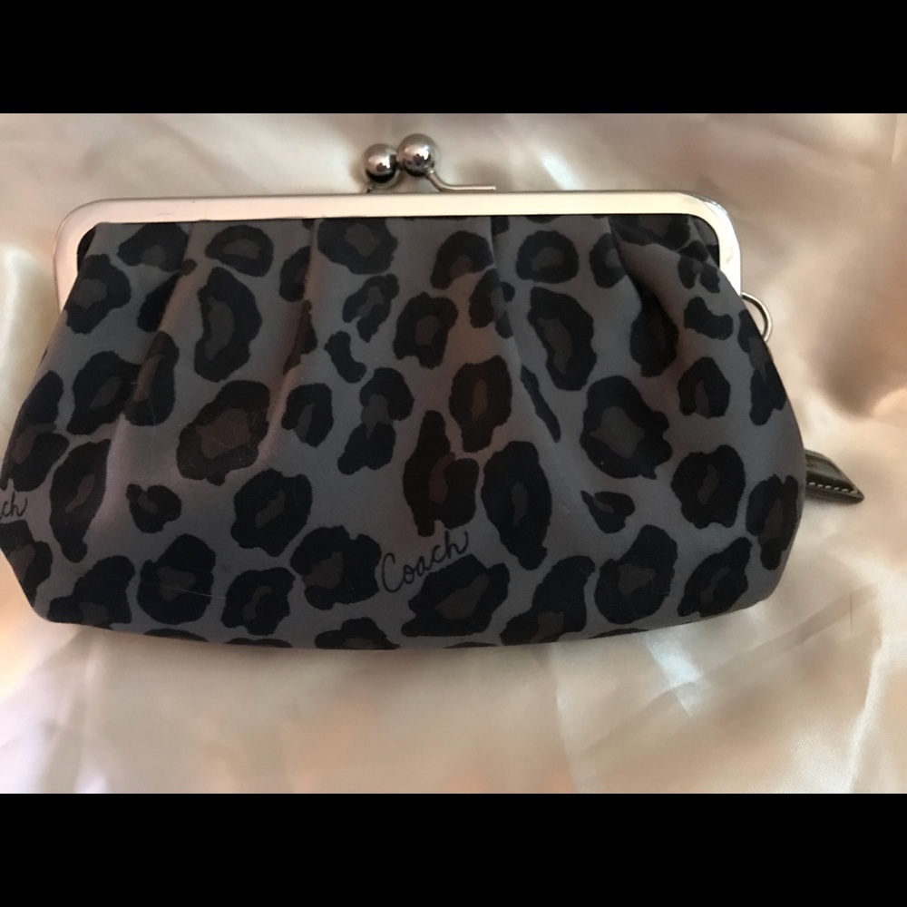 Coach ocelot kisslock wristlet Euc. Hard to fine